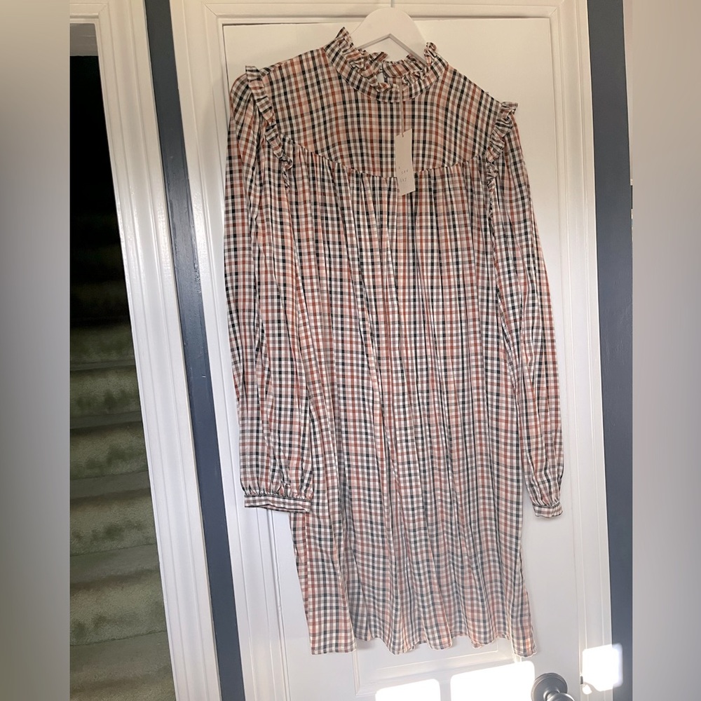 A New Day NWT plaid checkered dress in brown/black tones. Ruffle details-pockets